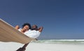 Young couple relaxing on hammock at beach Royalty Free Stock Photo