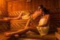 Young couple relaxing in a hot sauna Royalty Free Stock Photo