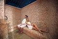 Young couple relaxing inside spa sauna turkish bath - Two lovers enjoying vacation in luxury resort hotel Royalty Free Stock Photo