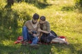 young couple looking at photos on a camera Royalty Free Stock Photo