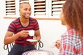 Young Couple Relaxing Outdoors And Drinking Coffee Royalty Free Stock Photo