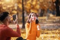 Couple relaxing in the park with bubble blower Royalty Free Stock Photo