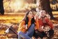 Couple relaxing in the park with bubble blower Royalty Free Stock Photo