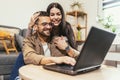 Couple relaxing on sofa with laptop.Love,happiness,people and fun concept Royalty Free Stock Photo