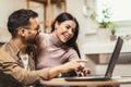 Couple relaxing on sofa with laptop.Love,happiness,people and fun concept Royalty Free Stock Photo