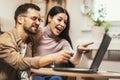 Couple relaxing on sofa with laptop.Love,happiness,people and fun concept Royalty Free Stock Photo