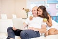 Young couple relaxing on sofa with laptop.Love,happiness,people and fun concept Royalty Free Stock Photo