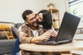 Couple relaxing on sofa with laptop.Love,happiness,people and fun concept Royalty Free Stock Photo