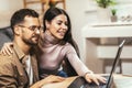 Couple relaxing on sofa with laptop.Love,happiness,people and fun concept Royalty Free Stock Photo