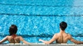 Young Couple relaxing in swimming pool Royalty Free Stock Photo