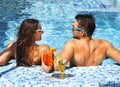 Young couple are relaxing at swimming pool Royalty Free Stock Photo