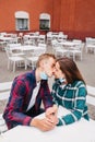 Young couple removing the mask and kissing. End of the epidemic