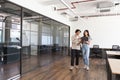 Young couple renting work space for start up business having informal meeting in open plan office Royalty Free Stock Photo