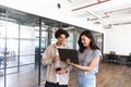 Young couple renting work space for start up business having informal meeting in open plan office Royalty Free Stock Photo