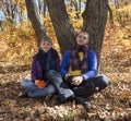 Young couple resting in autumn forest Royalty Free Stock Photo