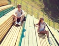 Young couple resting on the bench, youth, teenagers, fashion concept Royalty Free Stock Photo