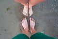 Young couple resting together at beach, top view. Legs on beach in summer time Royalty Free Stock Photo