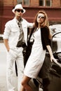 Young couple with a retro car Royalty Free Stock Photo