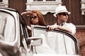 Young couple with a retro car Royalty Free Stock Photo