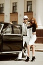 Young couple with a retro car. Royalty Free Stock Photo