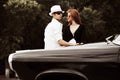 Young couple with a retro car Royalty Free Stock Photo