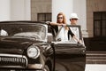 Young couple with a retro car Royalty Free Stock Photo