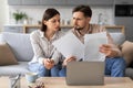 Young couple reviewing documents with concern Royalty Free Stock Photo