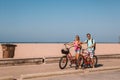 Young couple riding bicycles down the Venice beach in Los Angeles Royalty Free Stock Photo