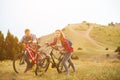 Young couple riding bikes in the mountains Royalty Free Stock Photo