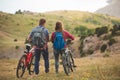 Young couple riding bikes in the mountains Royalty Free Stock Photo