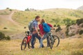 Young couple riding bikes in the mountains Royalty Free Stock Photo