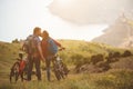 Young couple riding bikes in the mountains Royalty Free Stock Photo