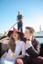 A young couple riding a gondola in Venice. Italy Royalty Free Stock Photo