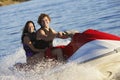 Young Couple Riding PWC