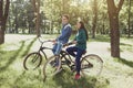 Young couple riding a retro bike