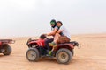 Young couple riding sand ATV Royalty Free Stock Photo