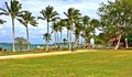 Young couple riding a tandem bicycle at a beach park