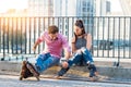 Young couple on rollerblades sitting. Royalty Free Stock Photo