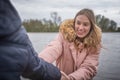 Young couple romp around at the water