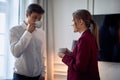 Young couple room enjoying coffee at the hotel at their business trip. Hotel, business, people Royalty Free Stock Photo