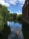 Young couple rowing down river Wensum, Norwich, Norfolk, East Anglia