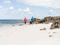 Young Couple Running along sea shore Royalty Free Stock Photo