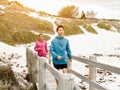 Young Couple Running along sea shore Royalty Free Stock Photo