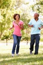 Young couple running in park Royalty Free Stock Photo