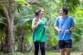 A young couple running in the park, Sport and love are combined in this concept, with a sporty man and woman working out together Royalty Free Stock Photo