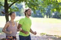 Young couple running in the park. Royalty Free Stock Photo