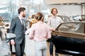 Couple choosing a new car in the showroom Royalty Free Stock Photo