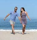 Young couple on sandy beach Royalty Free Stock Photo