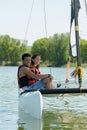 Young couple sat on catamaran Royalty Free Stock Photo