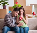 Young couple saving money for baby to be born Royalty Free Stock Photo